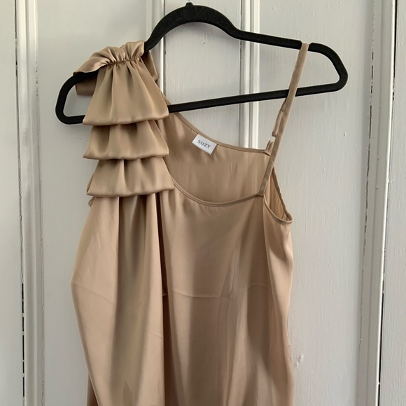 Gold satin blouse.